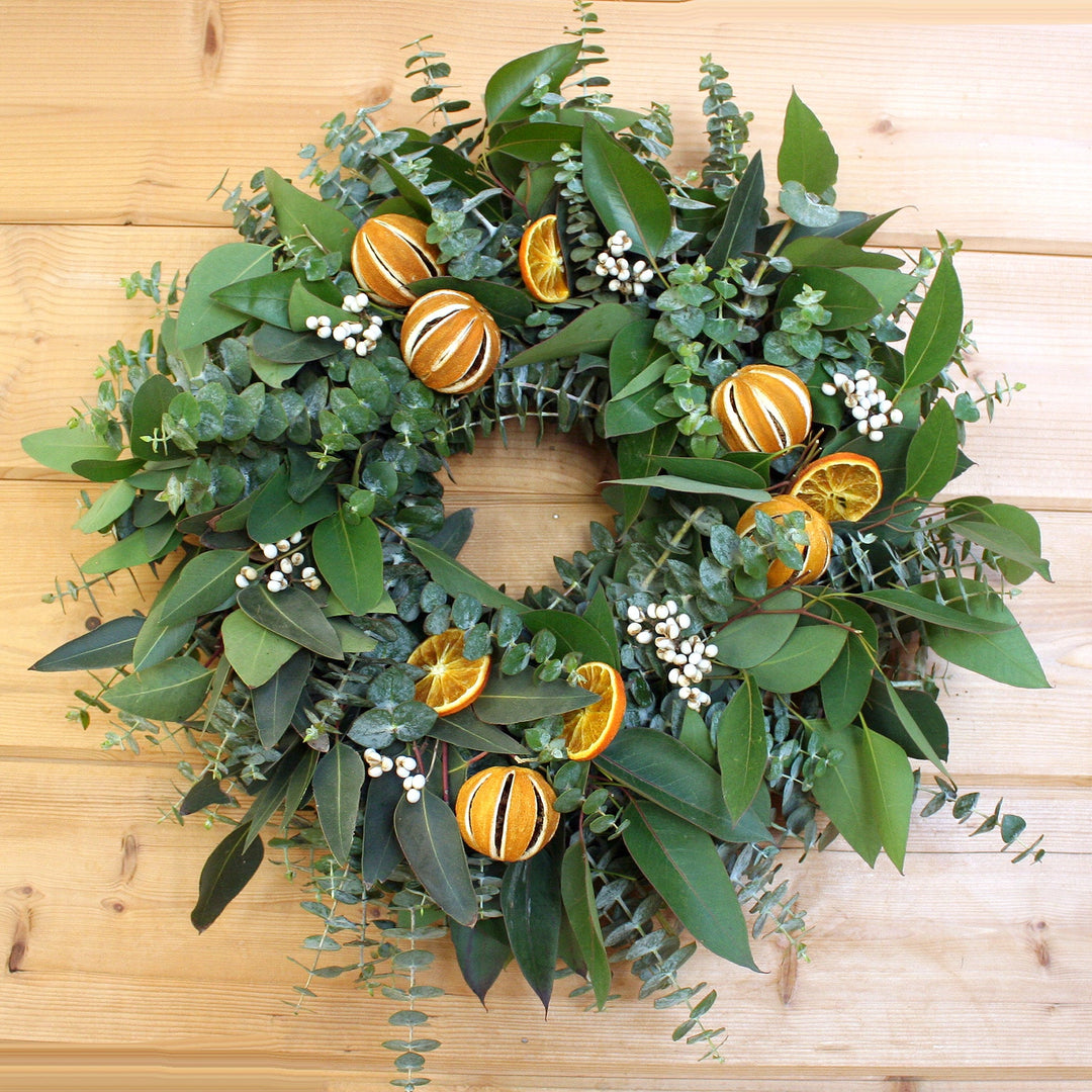 Eucalyptus Citrus Wreath - Creekside Farms Fresh mixed eucalyptus with tallow berries, orange slices and whole slit oranges wreath 20"