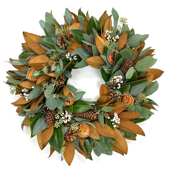 Holiday Magnolia Wreath - Creekside Farms Fresh Magnolia and seeded eucalyptus with orange and white accents wreath 18"/22"