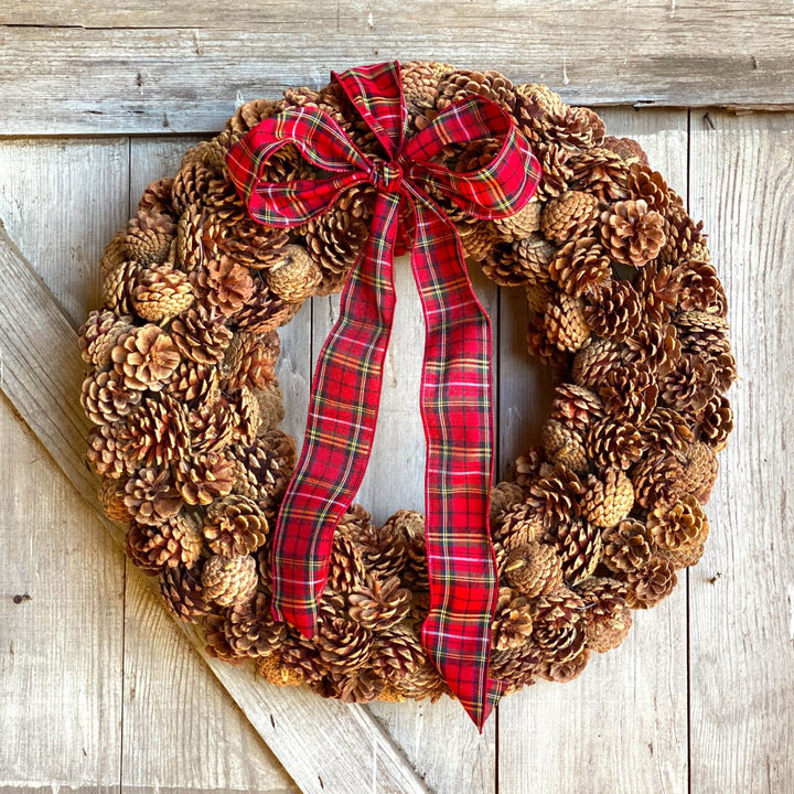 Pine Cone Wreath - Creekside Farms Made with an abundance of pine cones with tartan plaid wired bow wreath 24"