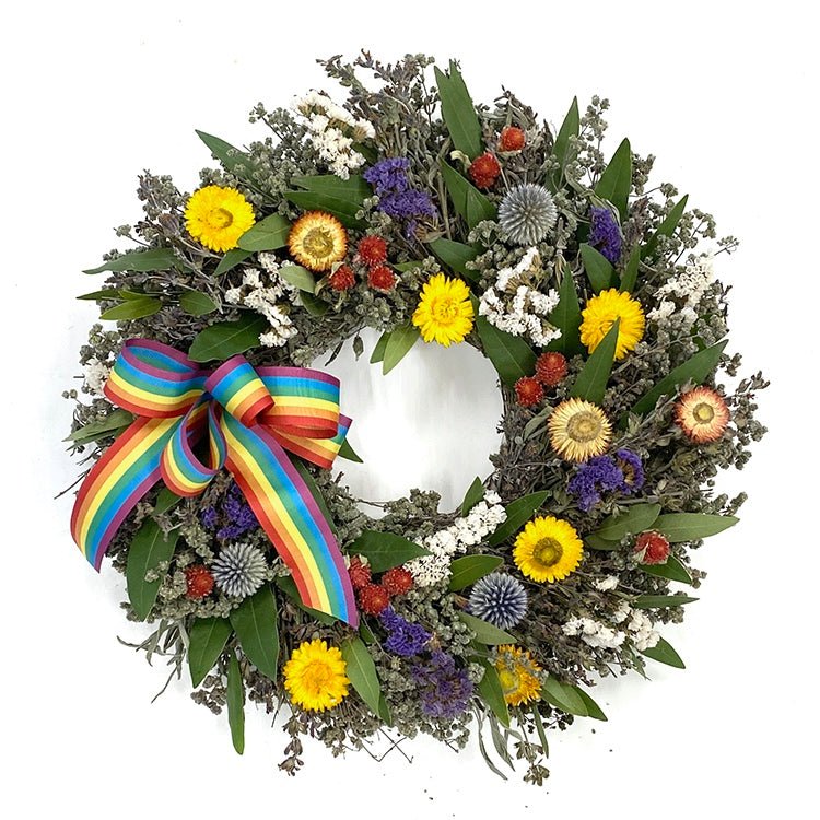 Pride Celebration Wreath - Creekside Farms Beautiful combination of bright and vibrant flowers and herbs with wired rainbow ribbon wreath 18"